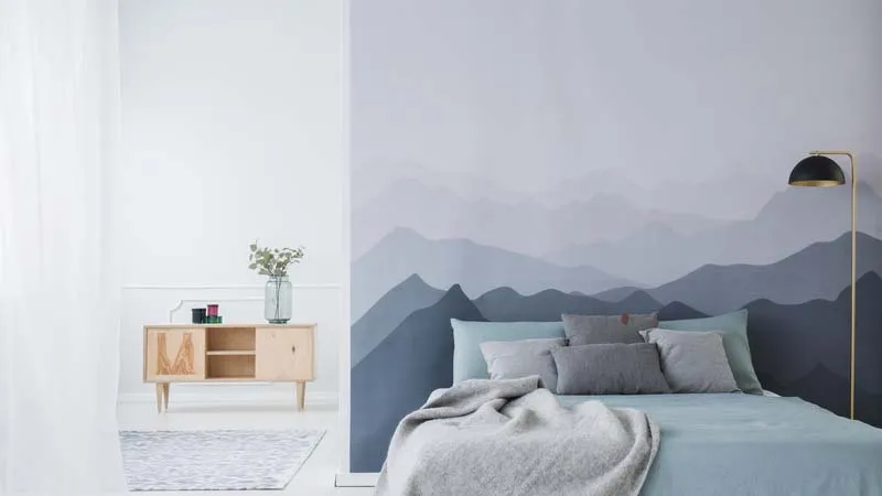 peaceful bedroom with blue mountain wallpaper
